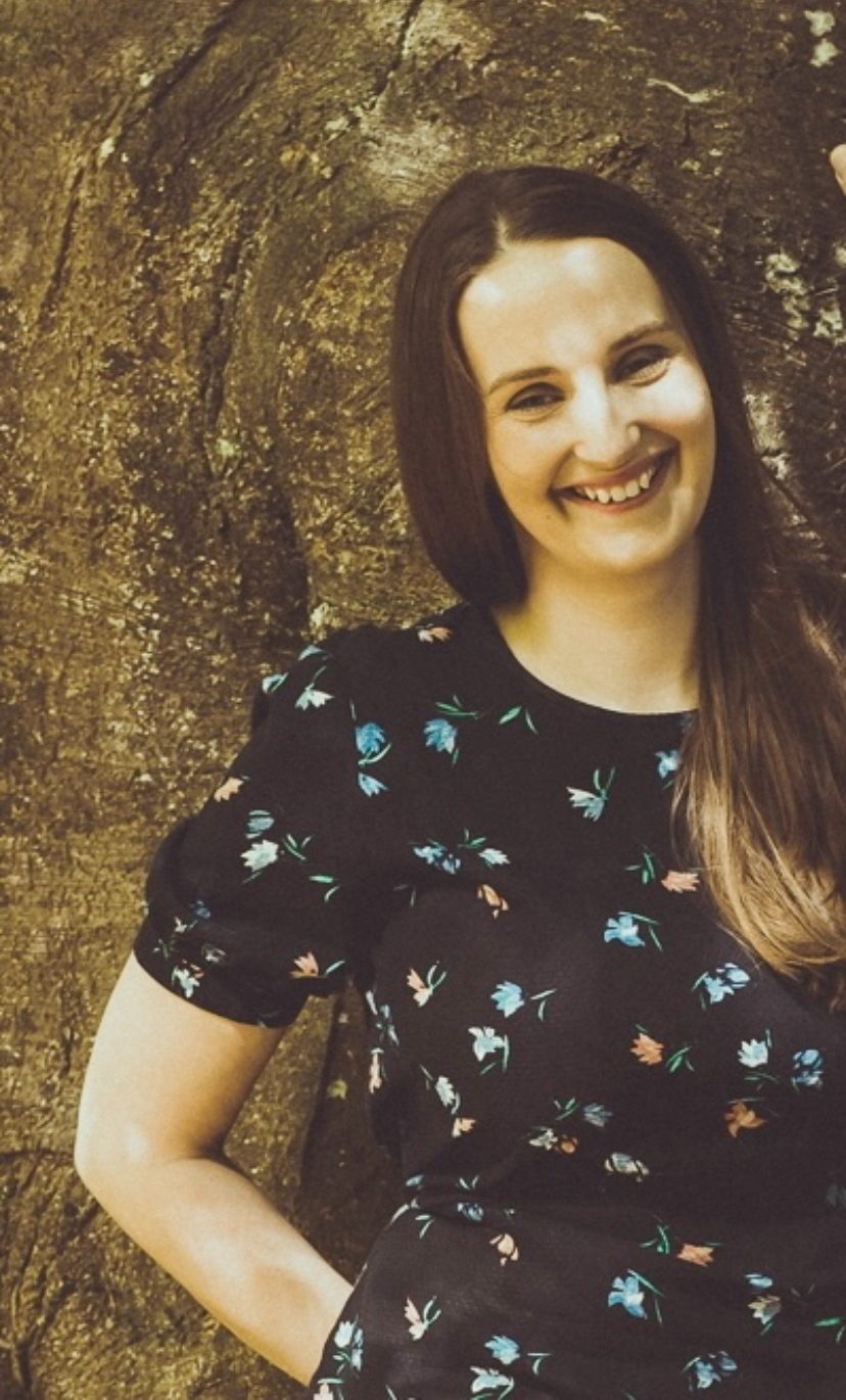 Amanda Kelly, occupational therapist, smiling outdoors